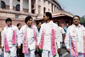 Telangana Rashtra Samithi Chief K Chandrasekhar Rao (second from right) along with his three MPs outside Parliament House after resigning from the membership over the Telangana issue in New Delhi