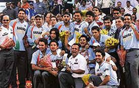 Members of the Indian cricket team are all smiles during a felicitation ceremony at the Ferozeshah Kotla Stadium in New Delhi