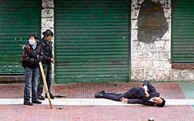 A protester lies injured in Lhasa