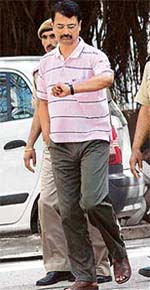 R.K. Sharma on way to court in New Delhi. Sharma said he would challenge his conviction