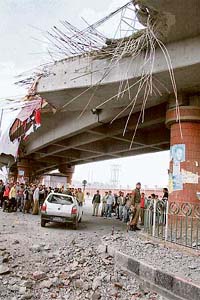 A damaged vehicle under a flyover after a blast rocked the Lal Chowk area near the civil secretariat in Srinagar