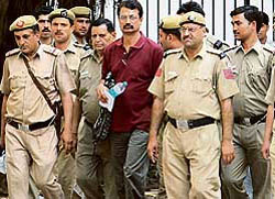 Former IPS Officer R.K. Sharma comes out of the Karkardooma Court in New Delhi on Thursday after attending the proceedings. The court reserved its order on the quantum of sentence against him till March 24.