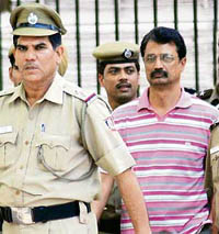 Ravi Kant Sharma arrives at Karkardooma Court in New Delhi on Monday.