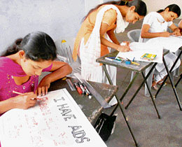 Students participate in a drawing competition related to AIDS awareness in Chandigarh.