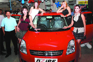 Maruti Suzuki unveils its new premium sedan Dzire at the Lovely Autos showroom in Jalandhar on Thursday.
