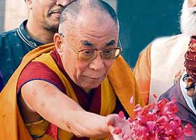 The Dalai Lama offers flowers at Rajghat in New Delhi