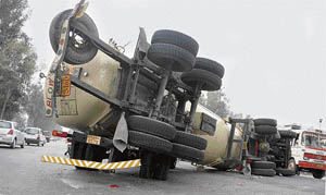 A gas tanker that flipped on the national highway in Ludhiana on Saturday.