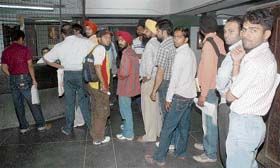 Students queue up to deposit fee at Panjab University after a cash counter was opened on a bank holiday on the PU campus