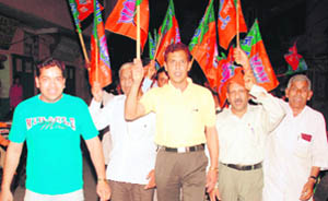 Leaders of the BJP and the BJYM hold a protest march at Ahmedgarh on Friday.