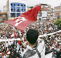 Thousands of supporters of Nepal's Maoist party await results outside a vote counting centre in Kathmandu.
