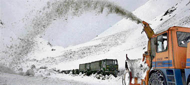 A snow-clearance machine in action as an Army convoy, carrying defence supplies, passes through the snow bound Zojila Pass, situated at a height of 11,578 feet, on its way to frontier region of Ladakh on Tuesday.