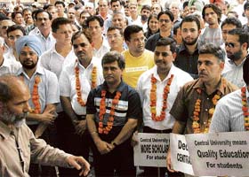 Staff and students participate in an open rally at Panjab University, Chandigarh