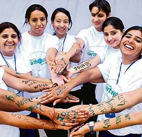 Panjab University students paint their hands to spread healthy environment message during the World Earth Day celebrations at the PU, Chandigarh