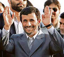 Iranian President Mahmoud Ahmadinejad waves on his arrival at the Air Force Station in New Delhi on Tuesday.