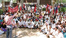 Labourers stage a dharna in front of the deputy commissioner’s office in Ludhiana on Tuesday on a call given by the Naujwan Bharat Sabha