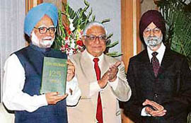Prime Minister Manmohan Singh releases "The Tribune 125 Years: An Anthology" while Mr H.K. Dua, Editor-in-Chief of The Tribune group of newspapers, and Mr R.S. Talwar, President of The Tribune Trust, look on at a function in New Delhi on Wednesday.