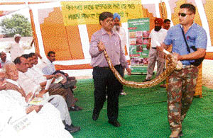 A python being exhibited by wildlife officials in association with an NGO. 