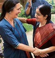BJP leader Sushma Swaraj greets CPM MP Brinda Karat on the presentation of Womens Reservation Bill in Parliament, in New Delhi on Tuesday.