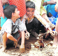 CLAY PLAY: Kids play with clay after rain lashed Ambala on Sunday.