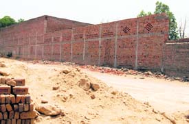 Illegal structures which have come up outside the Daria village in violation of the Periphery Act.