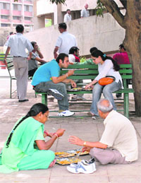 A couple, young and old, share meal at Student Centre in Panjab University on Friday.