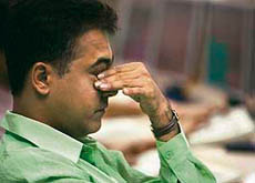 A broker reacts while trading at a stock brokerage firm in Mumbai on Monday.
