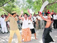 ATTACKing the menace: Members of the National Integrated Forum of Artistes and Activists stage street play "Allah Ke Naam Pe De De" at Plaza, Sector 17, Chandigarh, on Tuesday.