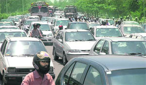 Commuters caught in traffic jam near Kala Gram on the Chandigarh-Panchkula road on Wednesday morning.