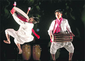 Indian dancers of the Peruvian Integro group perform during a production called Tawa at the Huaca Pucllana archaeological site in Lima.