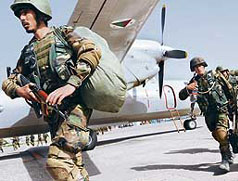 Afghan National Army soldiers rush to board an aircraft for Kandahar at the Kabul military airport ahead of a possible offensive against the Taliban.