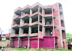 A view of the building being constructed by Darbari Lal, a former deputy speaker of the Punjab Vidhan Sabha, near the district courts, Amritsar