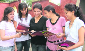 The students discuss the courses given in prospectus to take admission in colleges in Ludhiana.