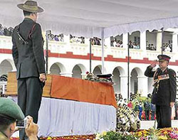 Lt-Gen Milan Naidu, Vice-Chief of the Army Staff, salutes the coffin of Field Marshal Sam Manekshaw in Wellington on Friday.