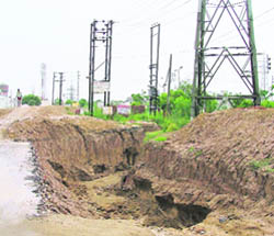 Earth has started to cave in even as power pylons line a trench precariously in Ludhiana.