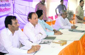 S.R. Kler, additional chief administrator of GLADA, conducts the auction of plots in Ludhiana
