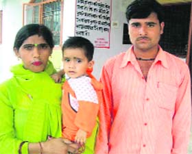 Sanjay Kumar (right) with wife and son Rahul