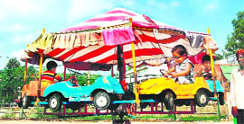 Kids have fun outside Mata Mansa Devi Mandir, Panchkula, on Sunday.