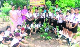 Students of Ram Lal Bhasin Public School plant saplings on the school campus in Ludhiana on Monday