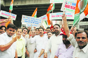 Activists of the Punjab Pradesh Youth Congress hold a march in Ludhiana on Wednesday.