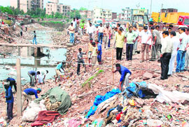 A cleanliness drive being carried out at Rajiv Colony in Panchkula on Sunday.
