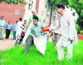 PU vice-chancellor R. C. Sobti leads the cleanliness drive on university campus early morning on Sunday.