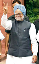 A confident-looking Manmohan Singh arrives for the special session of Parliament in New Delhi on Monday. 