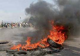 Protesters burn tyres at Balongi village in Kharar