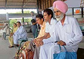 Passengers wait for buses during Punjab bandh in Mohali