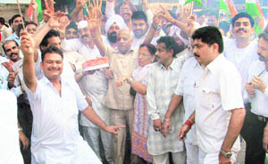 Congressmen celebrate winning of the confidence motion by the UPA government in Ludhiana on Wednesday.