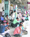 Passengers wait for trains that were delayed due to the bandh