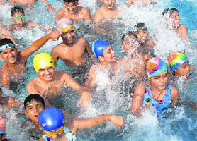 Children beat the heat at the Sec-23 swimming pool in Chandigarh on Friday.