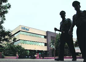 Private security guards patrol the Infosys campus in Bangalore
