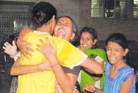 Relatives of victims of bomb blasts mourn at a hospital in Ahmedabad