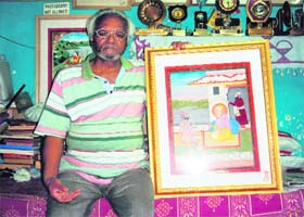 O.P. Tak with painting of Guru Ramdass at his studio in Dharamsala